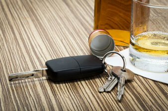 car key on bar with alcohol