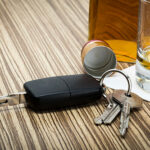 car key on bar with alcohol